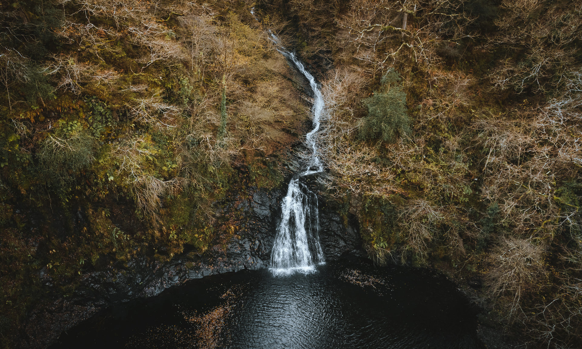 Photo of waterfall at Felenrhyd and Llennyrch woods on an autumn day.