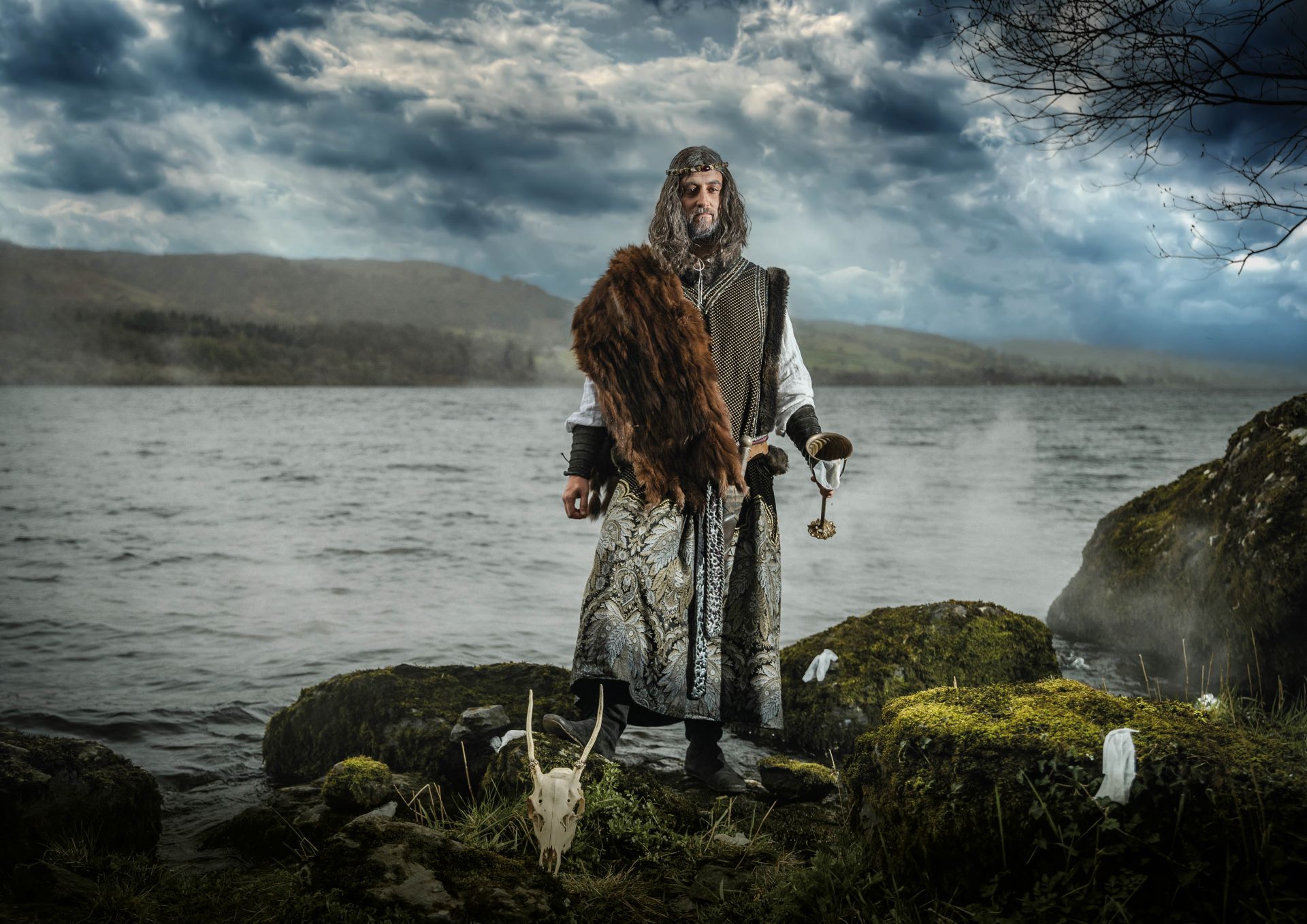 The mythical character, Pryderi, poses on the shores of Llyn Tegid.