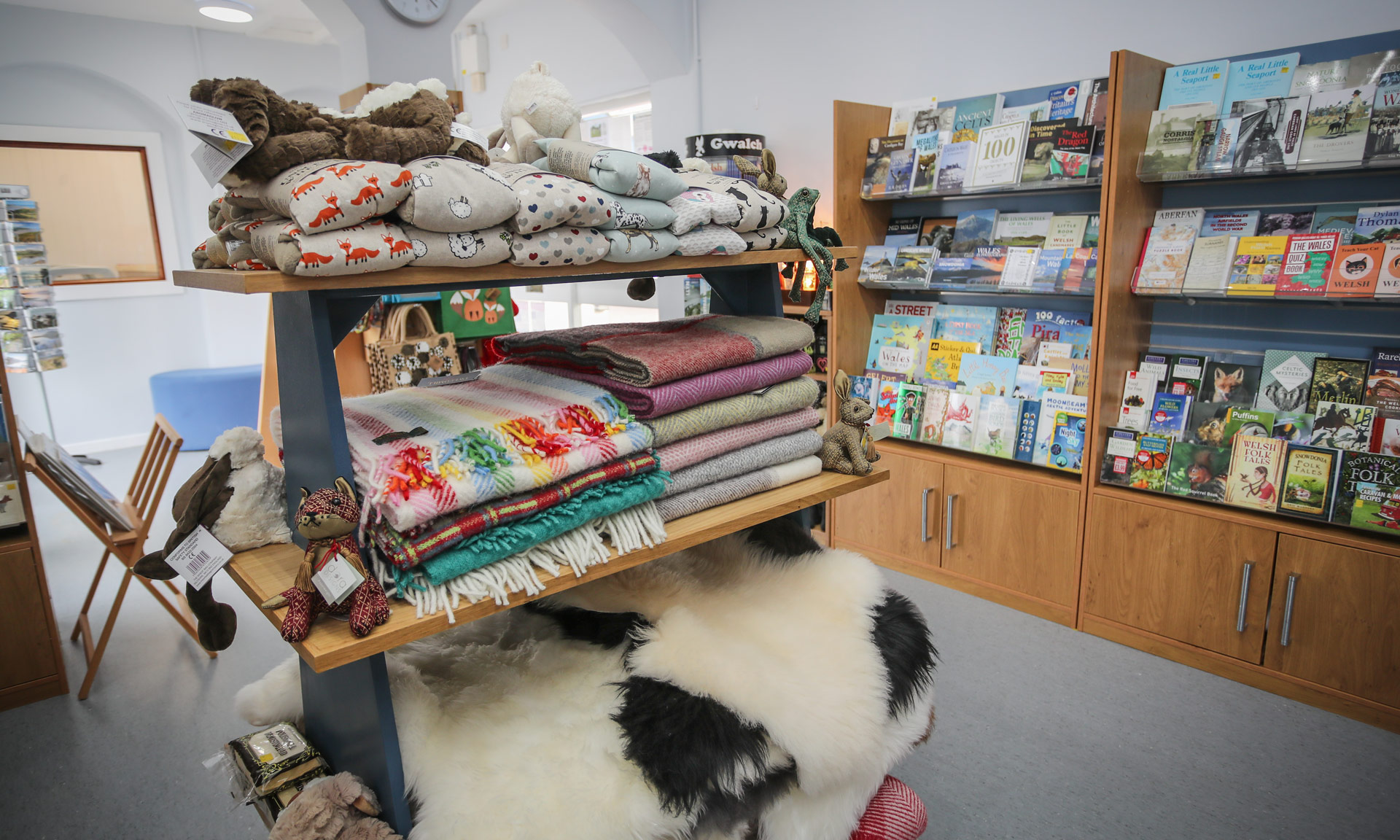 Products including books and blankets on display at Aberdyfi Information centre